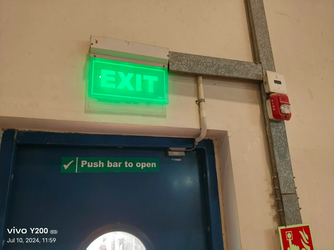 Emergency exit with fire hose reel box