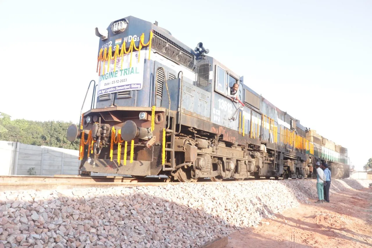 Decorated locomotive running on newly laid siding track during its engine trial