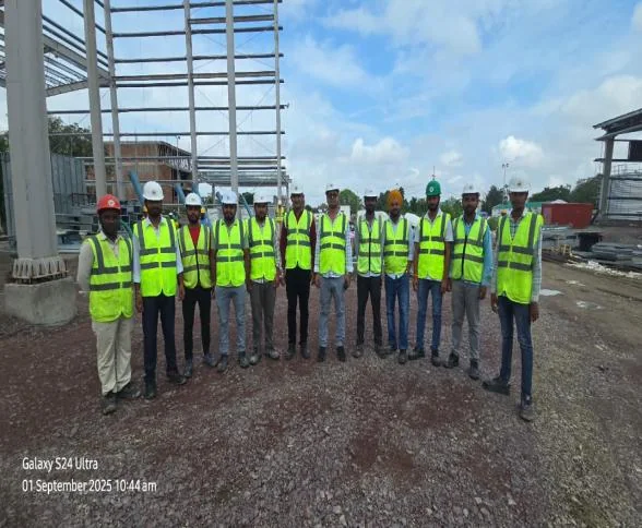 Project team assembled at a completed facility